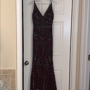 This dress was hemmed for my daughter who is 5’2.